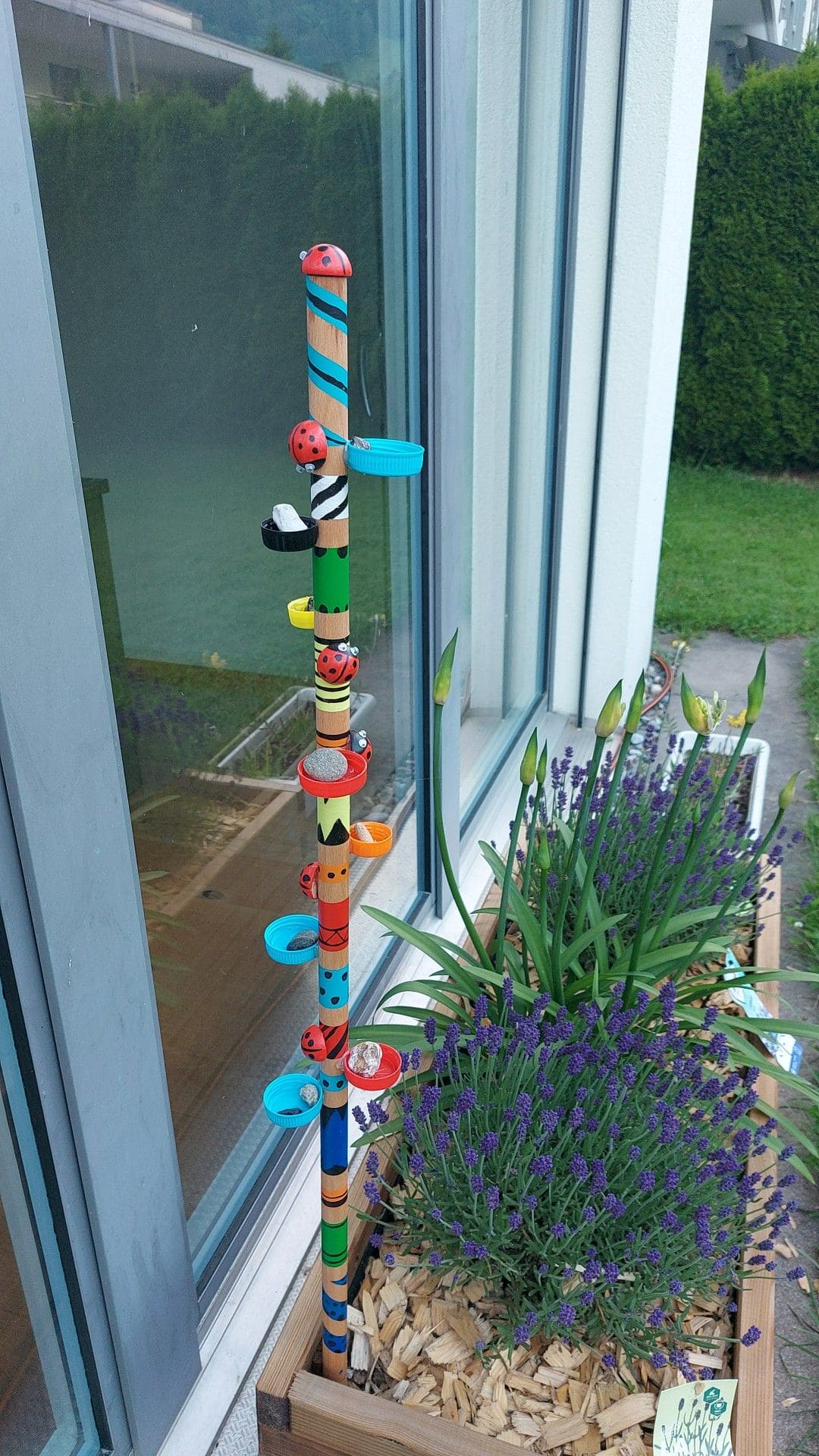 Painted Bug Totem with Bottle Cap Pebble Holders