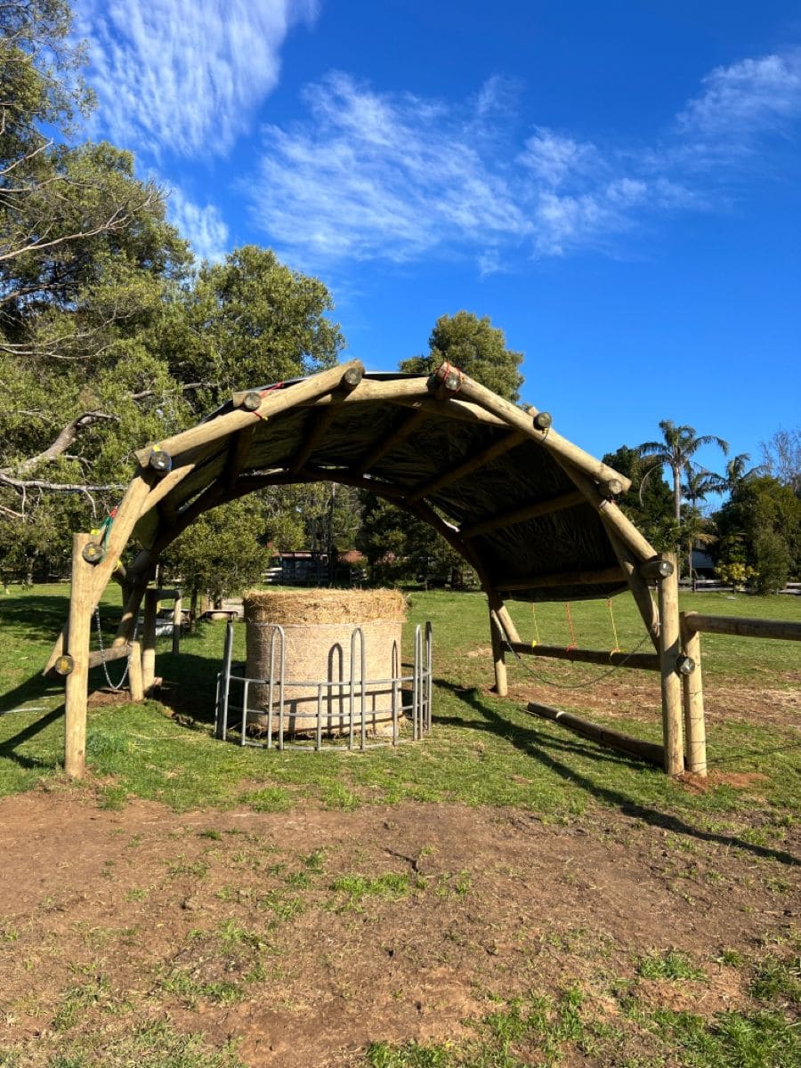 Arched Log Shelter for Feeding Area