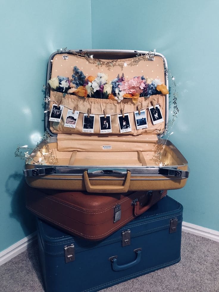 Whimsical Vintage Suitcase Display for Photos and Flowers